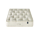 A white tufted mattress shown from a top-down angle on a plain white background. The brand name 'CAPSULE' is visible on the side of the mattress.
