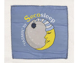 A square baby blanket in dusty blue with a central graphic of a sleeping yellow crescent moon and a gray moon wearing a striped navy and white nightcap. The text 'Secosleep' is printed in yellow and white above the graphic, and 'ASMIN' by' is printed vertically on the left side.