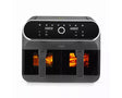 A dark gray multi-compartment air fryer with a glossy black digital control panel and glowing orange food inside three cooking baskets, shown on a white background.