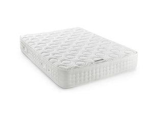 A white quilted mattress shown at an angle on a clean white background.