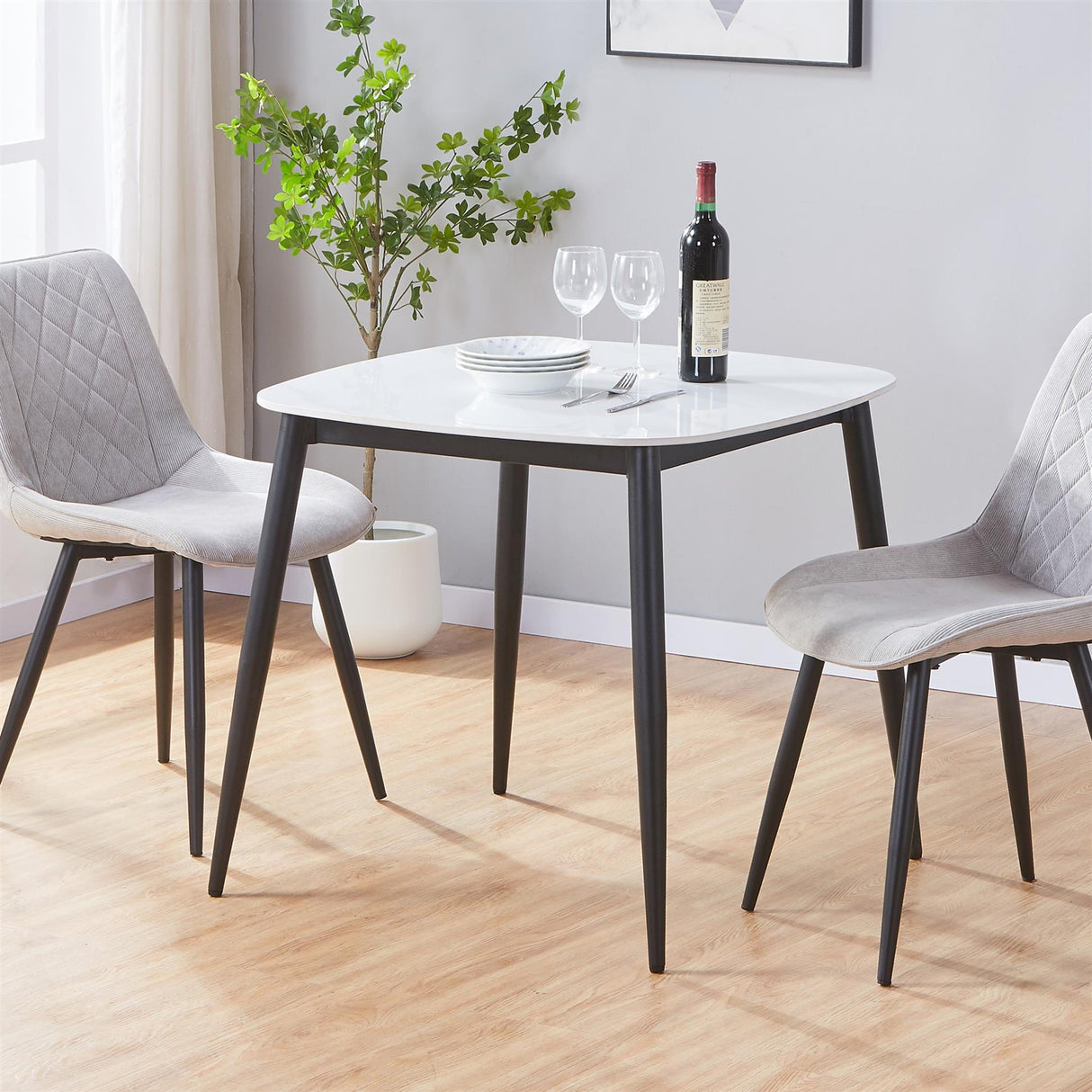Aspen square dining table, light oak effect top with black tapered legs
