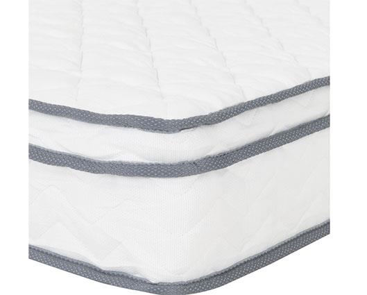 A close-up of a white quilted mattress with gray stitched trim along the edges, shown against a plain white background.