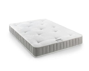 A white tufted mattress with a gray ribbed side border, shown at an angle on a clean white background.